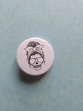 Skull with an updo badge