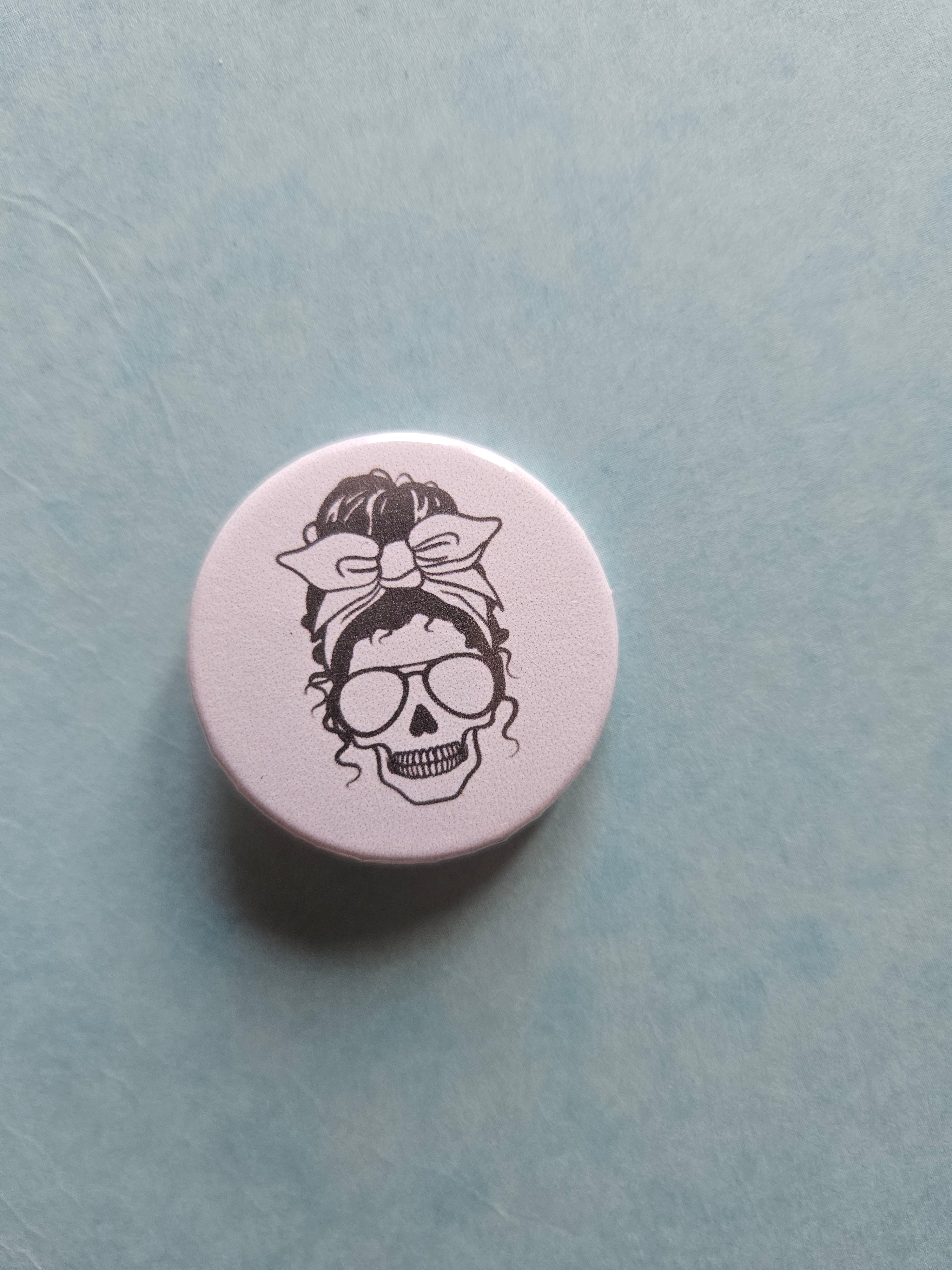 Skull with an updo badge